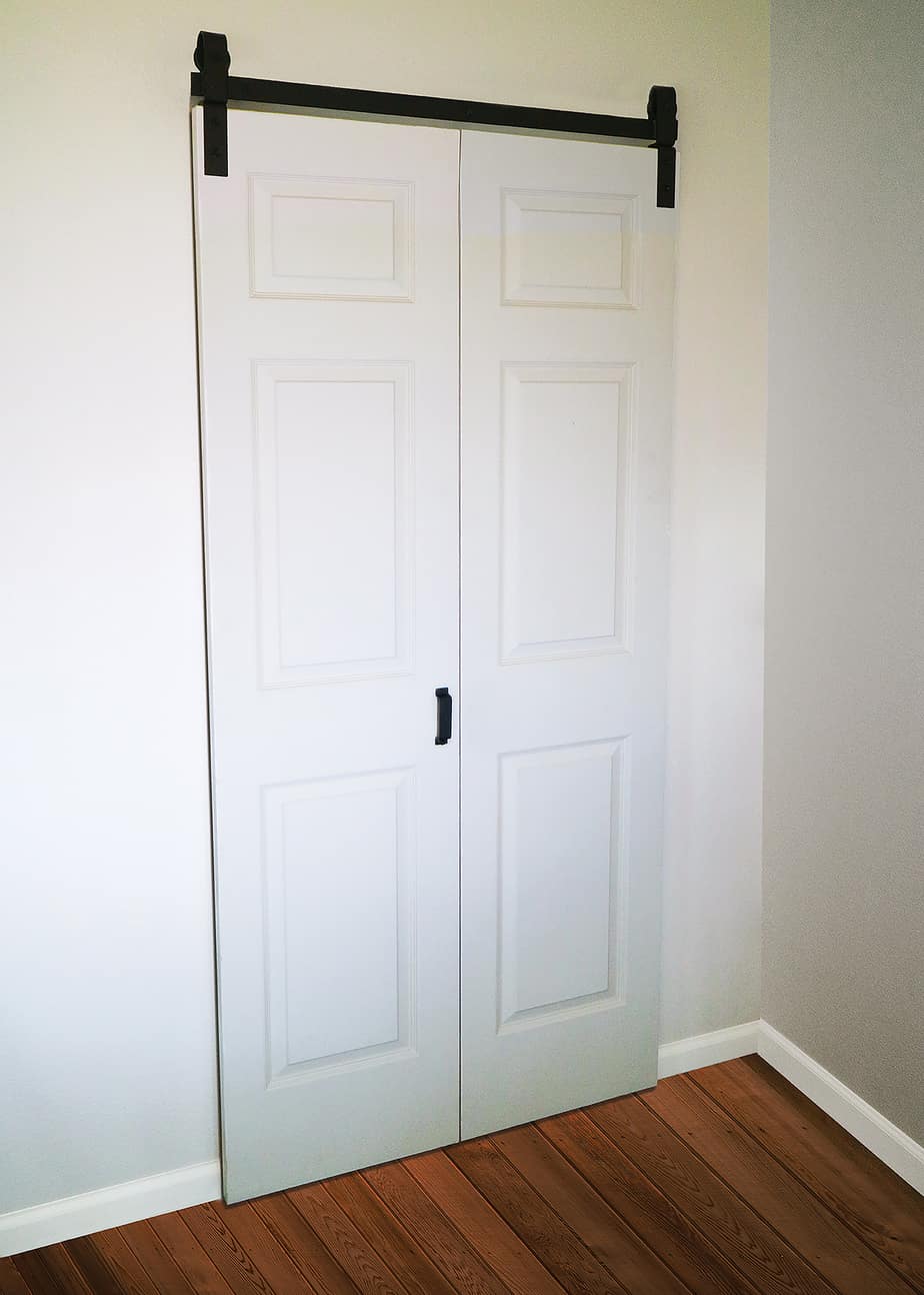 closed bifolding closet door with Barnfold folding barn door hardware