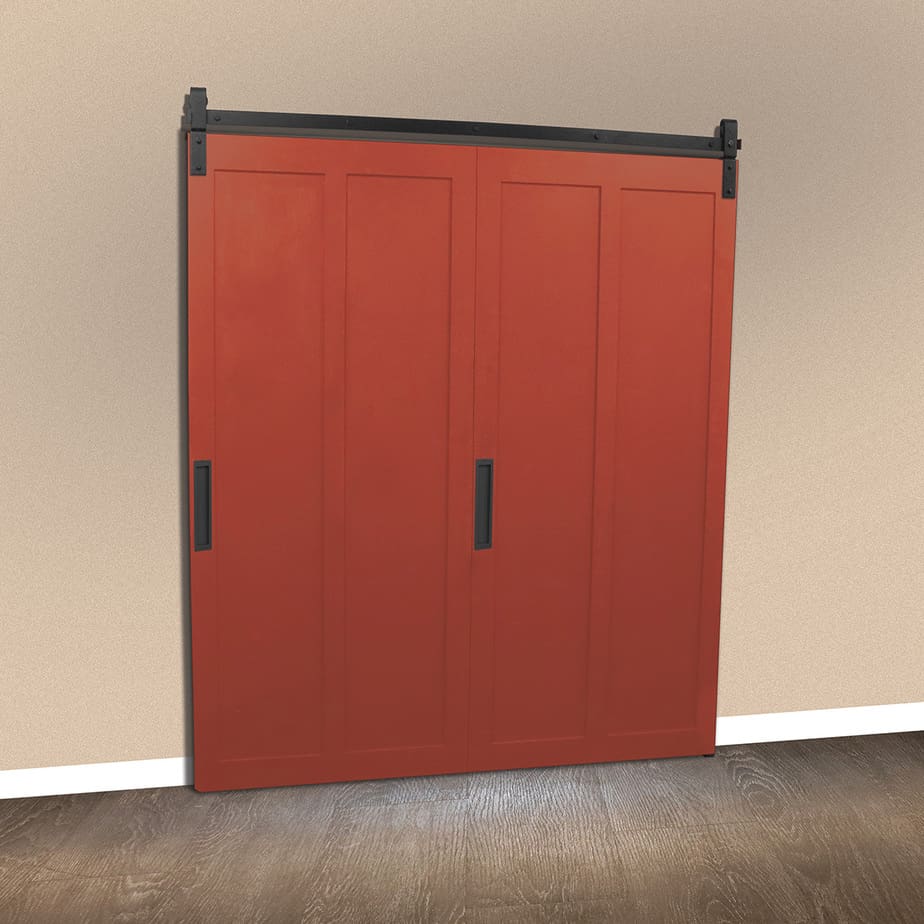 Goldberg Brothers Barnfold HD 2-panel folding barn door hardware on red doors, in closed position on the entrance to a room